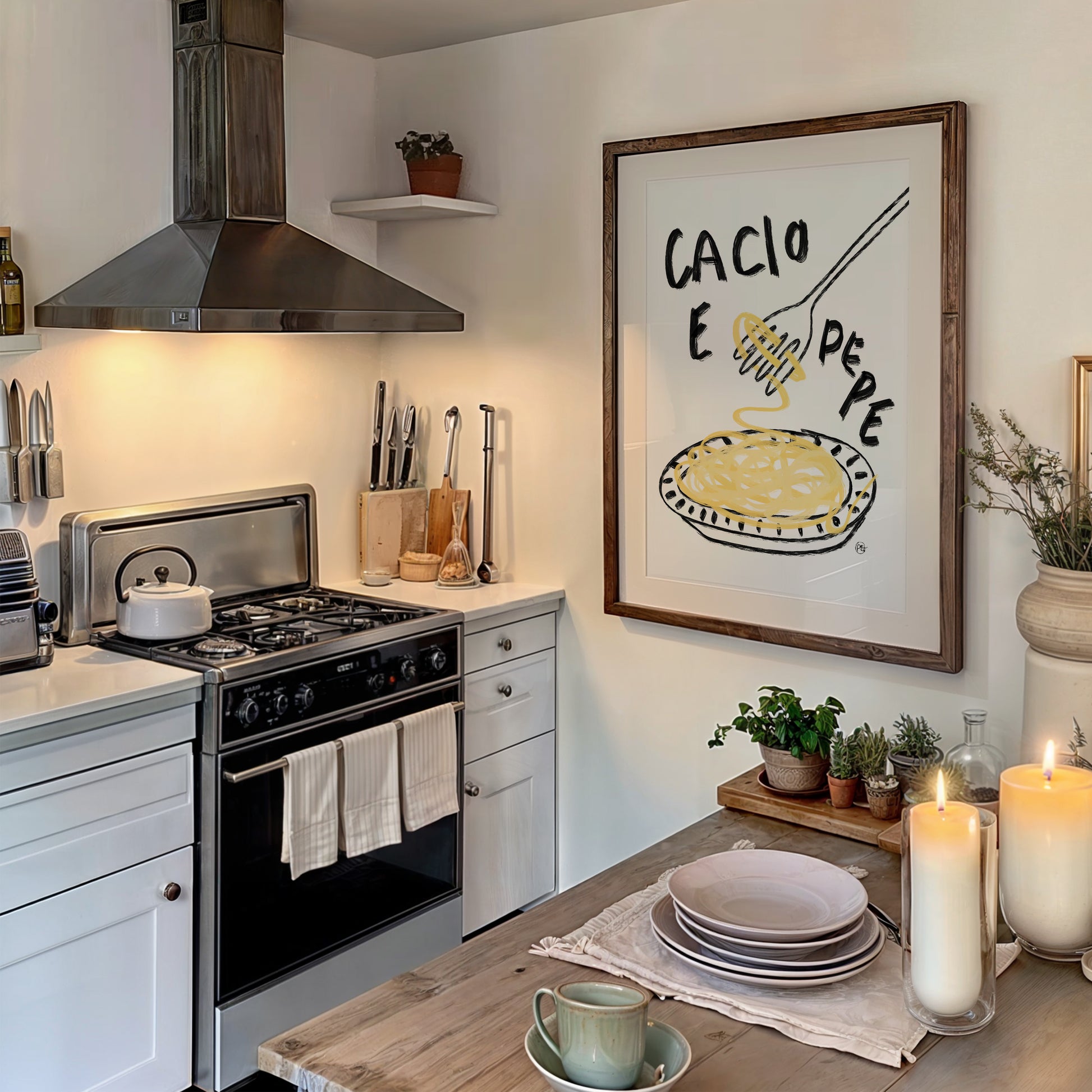 Kitchen with stove, utensils, and a framed cacio e pepe pasta print on the wall.