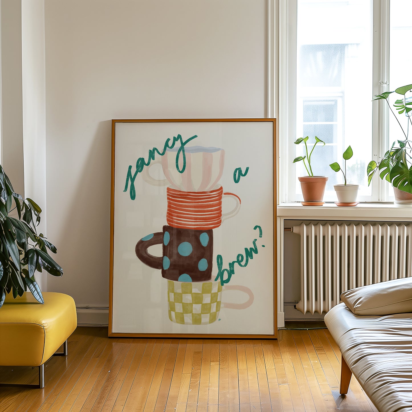 framed artwork of four colourful mugs and fancy a brew text in a bohemian living room setting