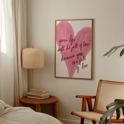 Heart-shaped artwork with motivational quote in a cozy room with a lamp and chair.