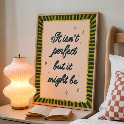 Framed quote on a nightstand next to an open book and lamp.