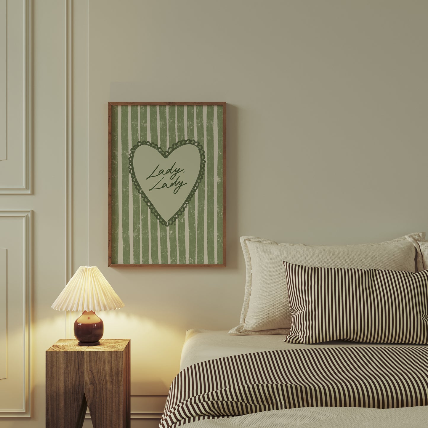 Bedroom with striped bedding, nightstand, and framed artwork of lady lady lyrics on the wall.