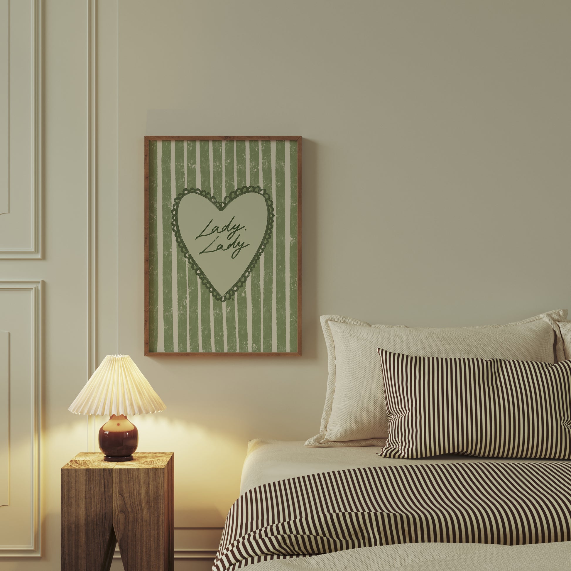 Bedroom with striped bedding, nightstand, and framed artwork of lady lady lyrics on the wall.
