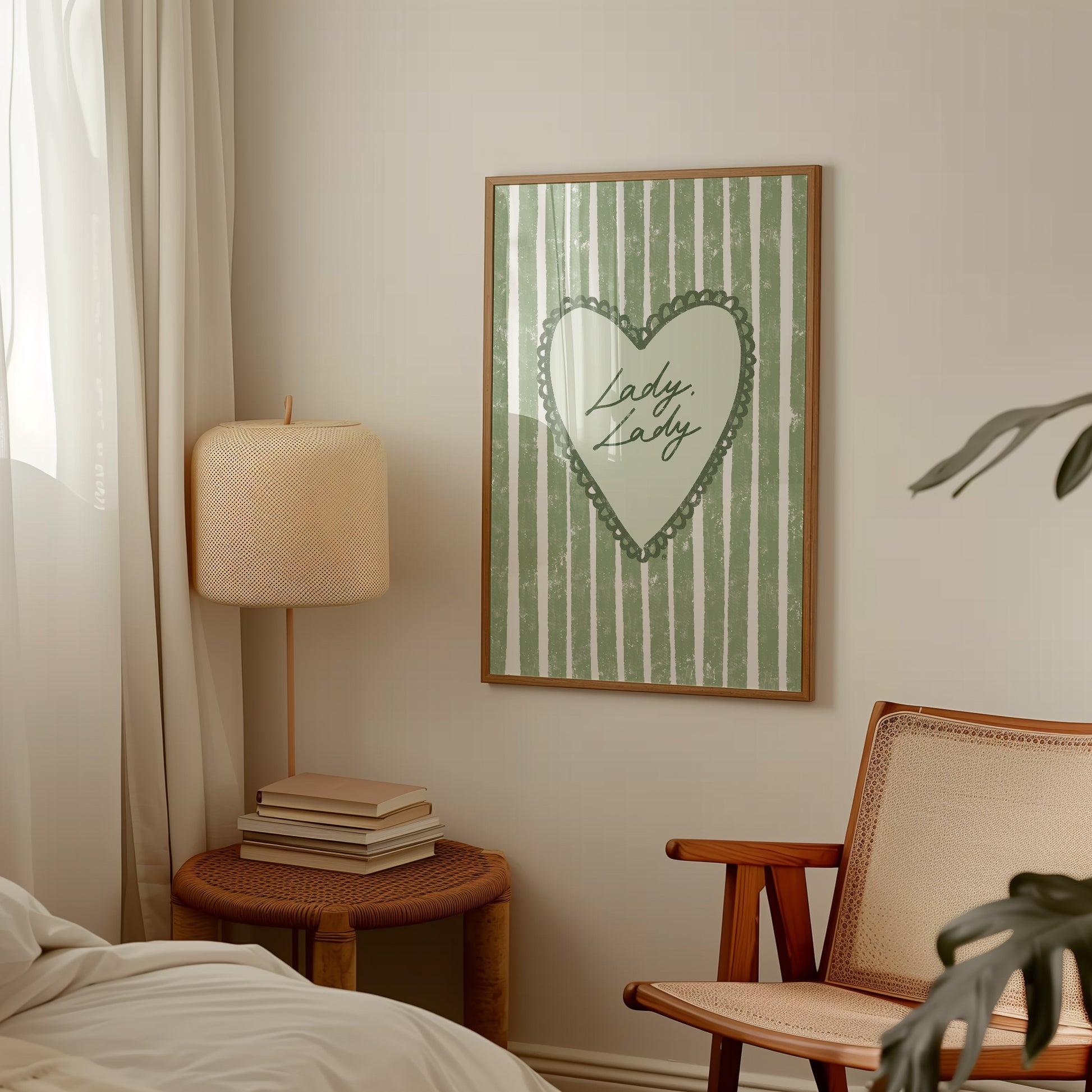 Scandi room interior with a framed picture of lady lady lyrics artwork on the wall, a lamp, and chair.