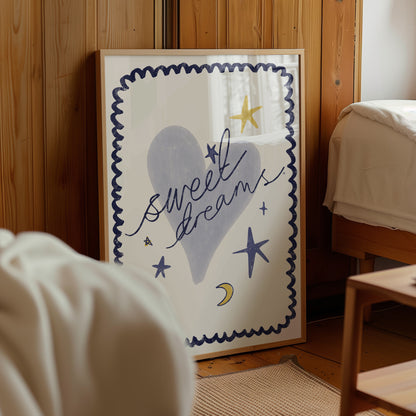 Framed artwork with 'sweet dreams' text and star illustrations on a wooden wall.