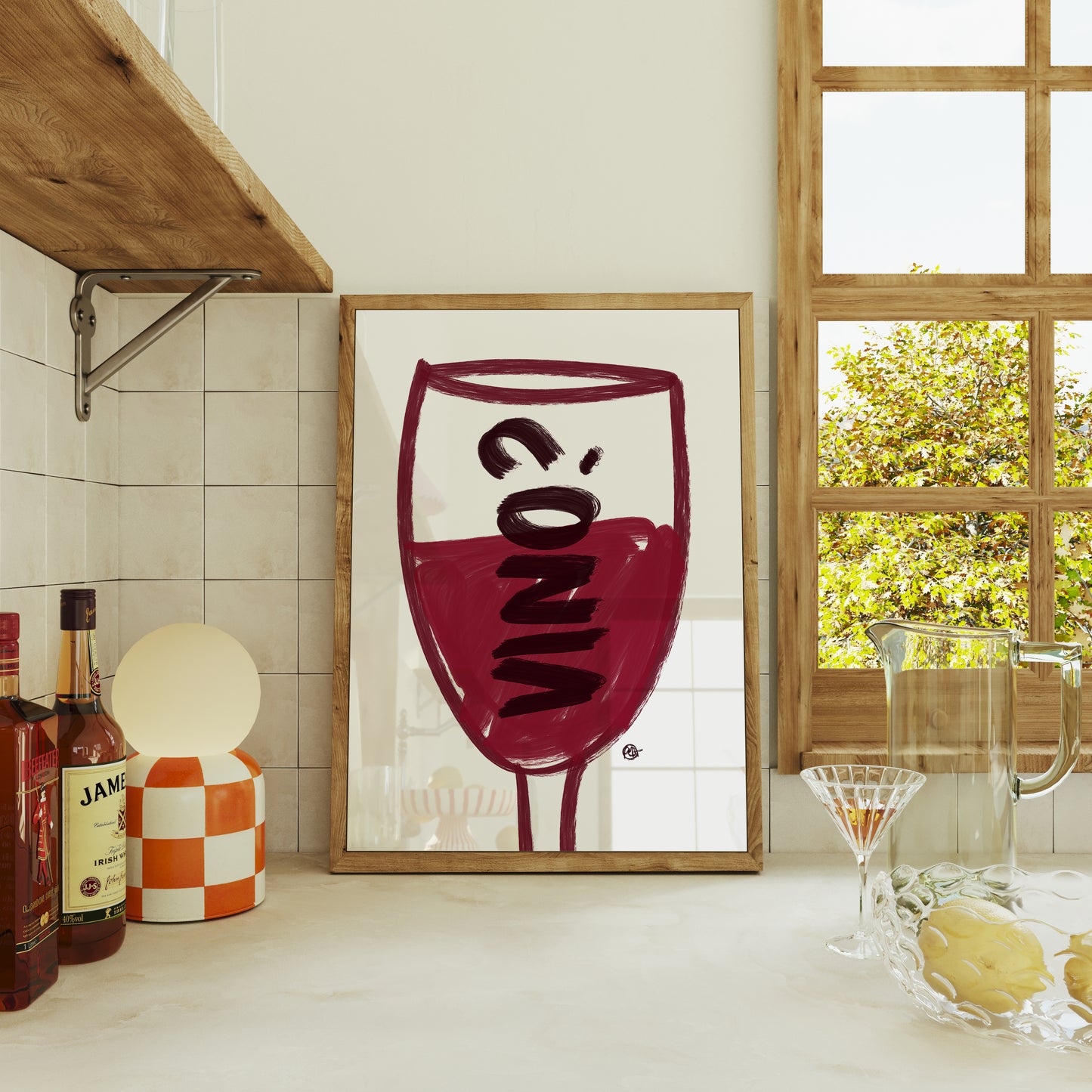 Framed artwork of a wine glass with the word 'Vino' in a kitchen setting.
