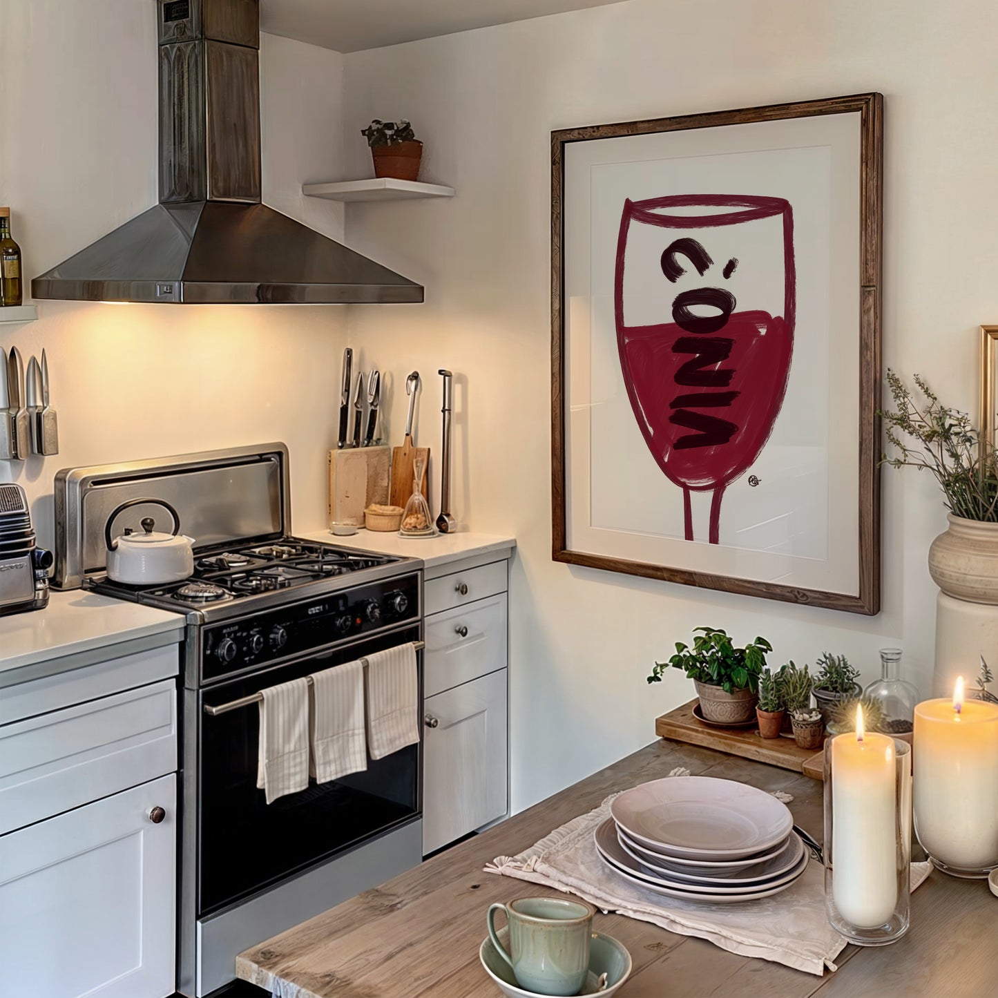Kitchen with a wine-themed painting on the wall, candles, and plates.