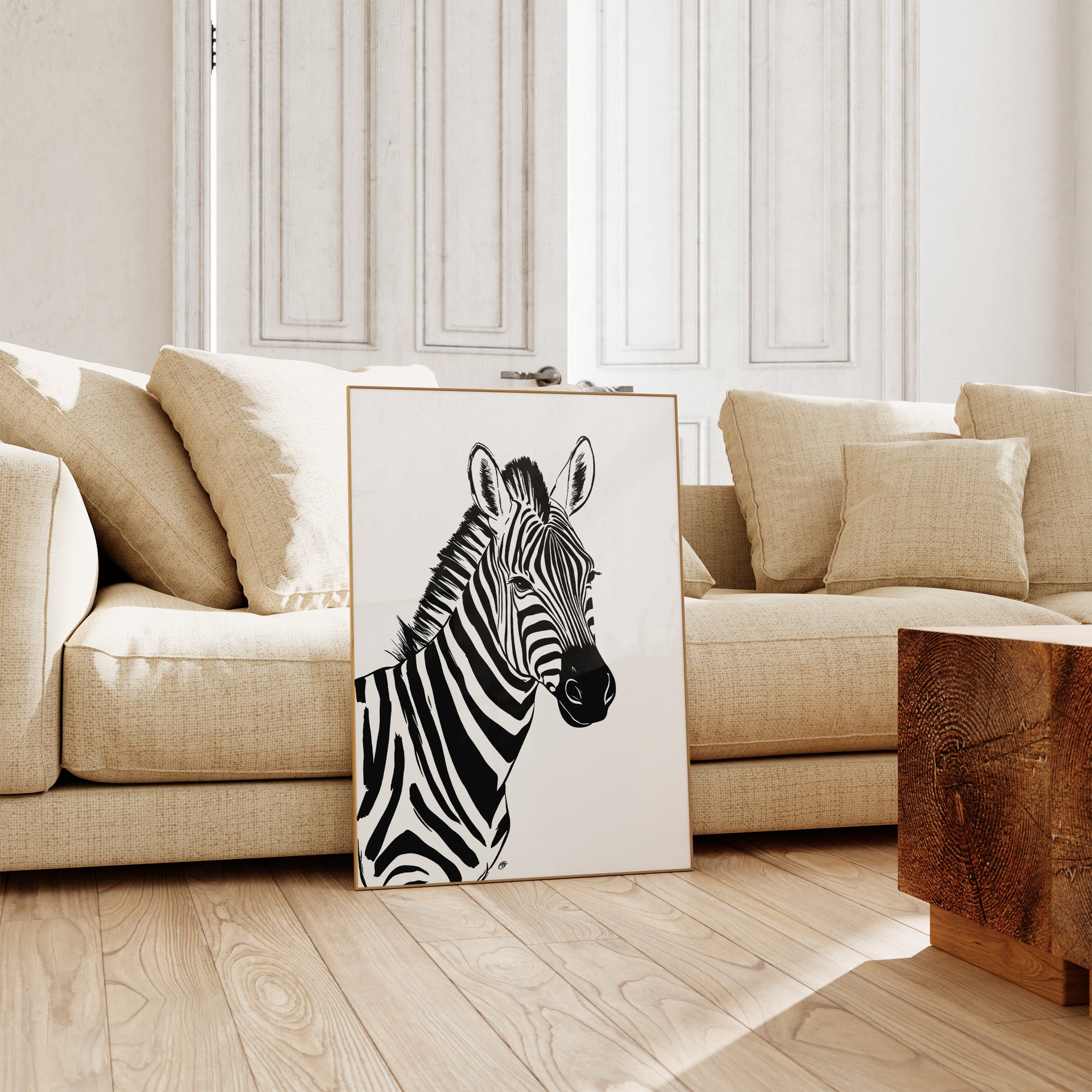 Zebra painting on a wooden floor in a living room with beige sofa and wooden coffee table.